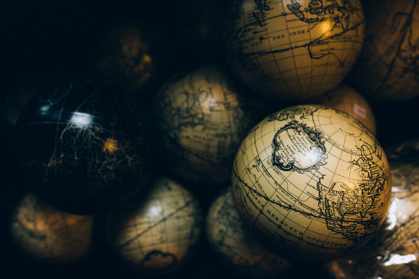 Birds eye view of antique globes stacked on top of each other